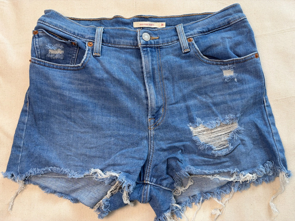 Levi’s High Rise Women’s Denim Cutoff Shorts Size 31 Distressed Blue Raw Hem